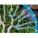detail close up glass beads entwined into twisted wire branches