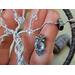 hematite chips, 20g wire, small metal owl charm, crystal clear glass beads, embroidery floss wrapped hoop