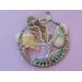 front view pink backgroundfront facing wire tree leaning against river rock and quartz