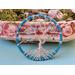 standing tree display to show size comparison this is a small suncatcher with various blue hues of glass beads 