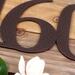 Close up of copper vein powder coat on our metal house number sign.