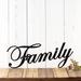 Metal family sign with script writing, in matte black powder coat.