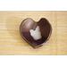 Ceramic heart shaped spoon rest. Glazed in dark purple and cream color. Approximately 3"x3.5"