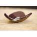 Ceramic heart shaped spoon rest. Glazed in dark purple and cream color. Approximately 3"x3.5"