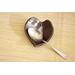 Ceramic heart shaped spoon rest. Glazed in dark purple and cream color. Approximately 3"x3.5"