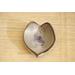 Ceramic heart shaped spoon rest. Glazed in grayish blue and purple colors. Approximately 3"x3.5"