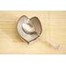 Ceramic heart shaped spoon rest. Glazed in grayish blue and purple colors. Approximately 3"x3.5"