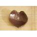 Ceramic heart shaped spoon rest. Glazed in cool red and mint green speckles. Approximately 3"x3.5"