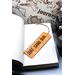 Front of bookmark with orange background, black handwritten lettering, black and white dot art, turtles and starfish.  Jute rope tassel.