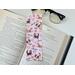 this cute dogs bookmark has a pink background with cute puppies pink hearts and flower along with 'I love you' all over the laminated bookmark.