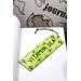 Front of bookmark, lime green background, black handwritten lettering, turtles, starfish and jute rope tassel.