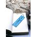 Front of bookmark, light blue background, black handwritten lettering, turtles, starfish, jute rope tassel.
