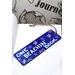 Front of bookmark, royal blue background, handwritten letting in white, starfish, turtles, jute rope tassel.