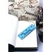 Front of bookmark, light blue background, black handwritten lettering, starfish, turtles, jute rope tassel.