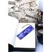 Front of bookmark, royal blue background, handwritten white lettering, various dot art designs and jute rope tassel.
