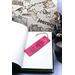 Front of bookmark, hot pink background, black handwritten lettering, black and white dot art designs around edge.  Jute rope tassel.
