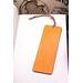 Back of bookmark solid orange and jute rope tassel.