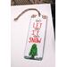 Front of bookmark, white background, red lettering, Christmas Tree and jute rope tassel.