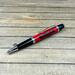 red, black, and chrome jeep pen
