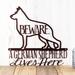Close up of German Shepherd Lives Here Metal Sign with Beware, in copper vein powder coat.