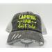 'Camping Hair Don't Care' distressed trucker hat. Neon yellow embroidery on vintage gray mesh. Perfect for adventurous campers