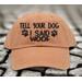 Get ready to make other dog lovers smile with this playful "Tell Your Dog I Said Woof" baseball cap.