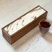 Tea chest holds 50 tea bags, great for organizing.  White background with streaks of metallic gold and black with a glossy finish.