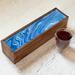 Periwinkle ribbons top this 5-compartment wooden tea box. Great for entertaining, holds up to 50 tea bags. Time for a tea party!