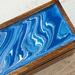 Blue and white with glossy finish to top  of tea organizer.
