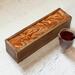 Wooden tea box holds 50 tea bags. Rich terra cotta and gold swirls with glossy resin finish. Great gift for tea lovers, or wedding.