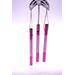 Close up of pink metal chimes and silver line