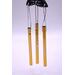 Close up of metal chimes with silver line