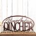 Oval family name metal sign with first names and last name, in copper vein powder coat.