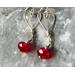 Designed with Valentines Day in mind, quality argentium silver wire is worked into hearts to which red crystal beads are attached.