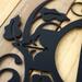 Close up of matte black powder coat on our metal monogram plaque. 