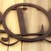 Close up of copper vein powder coat on our metal monogram sign.