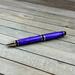 Bright purple ballpoint pen