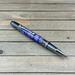 purple dyed art deco pen