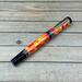 red yellow and orange mosaic fountain pen