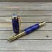 purple and gold rollerball pen
