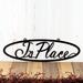 Oval personalized metal name plaque, in matte black powder coat.