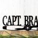 Close up of lettering on our Aviator metal name sign with established year, in matte black powder coat.