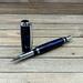Blue and purple rollerball pen