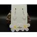 Big white machine embroidered daisy flower dangle earrings with a yellow center. Silver hypoallergenic hooks.