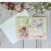 A pastel card with butterfly and floral scrapbook paper, light yellow cardstock, and a stamped sentiment with the words "rejoice" in pink.