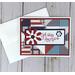 A patriotic God Bless America greeting card with patchwork quilt design and red, white and blue flowers.