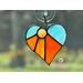 Heart-Sun ornament in direct sunlight in orange-yellow
