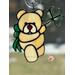 Saint Patrick's Day Bear suncatcher in direct sunlight- Cream