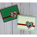 A card making kit with cream and green cherry embossed cardstock, with red ribbons and cherry fabric and burlap heart embellishments.