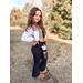 Pineapple Lace Water bottle sling/carrier in black with a full-sized water bottle. Great for hiking, day out, shopping trip, conferences.